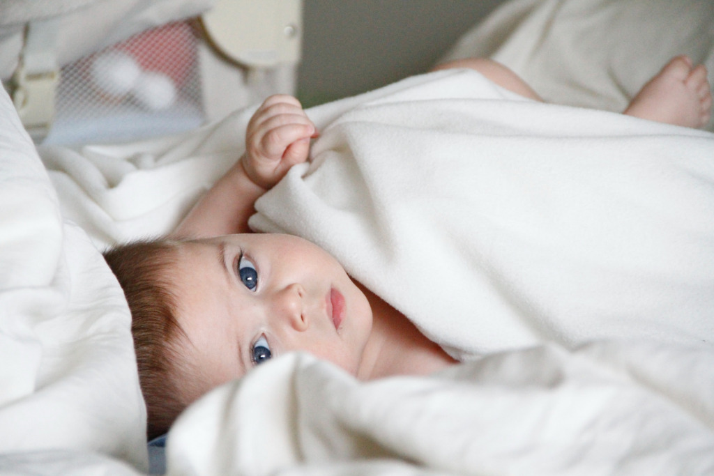 child under weighted blanket